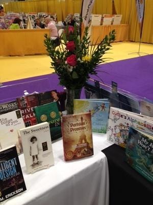 BEA 2015 Indie Press Collective booth — display table with books and floral arrangement